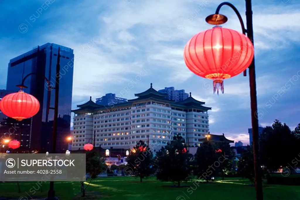 China, Xi'an, ANA Grand Castle Hotel, Traditional red Chinese lanterns are aglow in front of the hotel near the Xi'an City Wall.