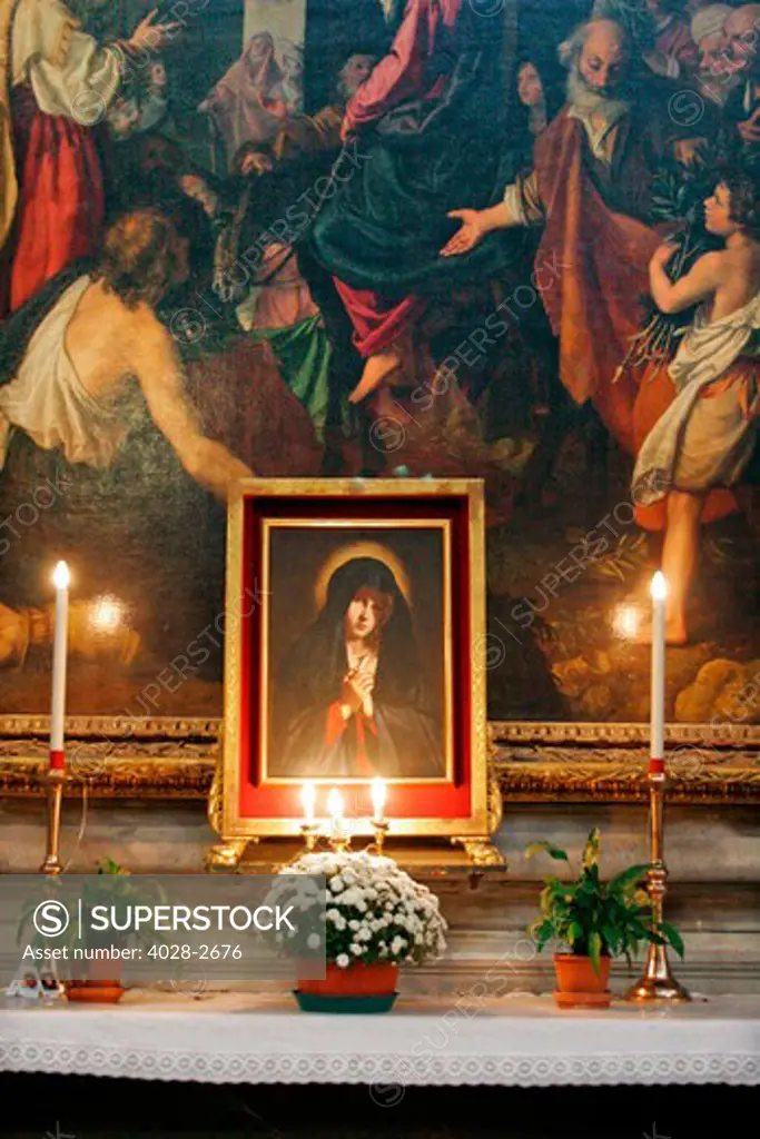 Pisa, Italy, Tuscany, Piazza dei Miracoli, painting of Mary alite by candles inside the Baptistery and Duomo Cathedral