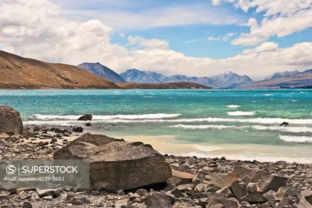 New Zealand, South Island, Oceania, Canterbury, Coastal landscape along the shores of Lake Tekapo, with the Two Thumb range and Mount Cook