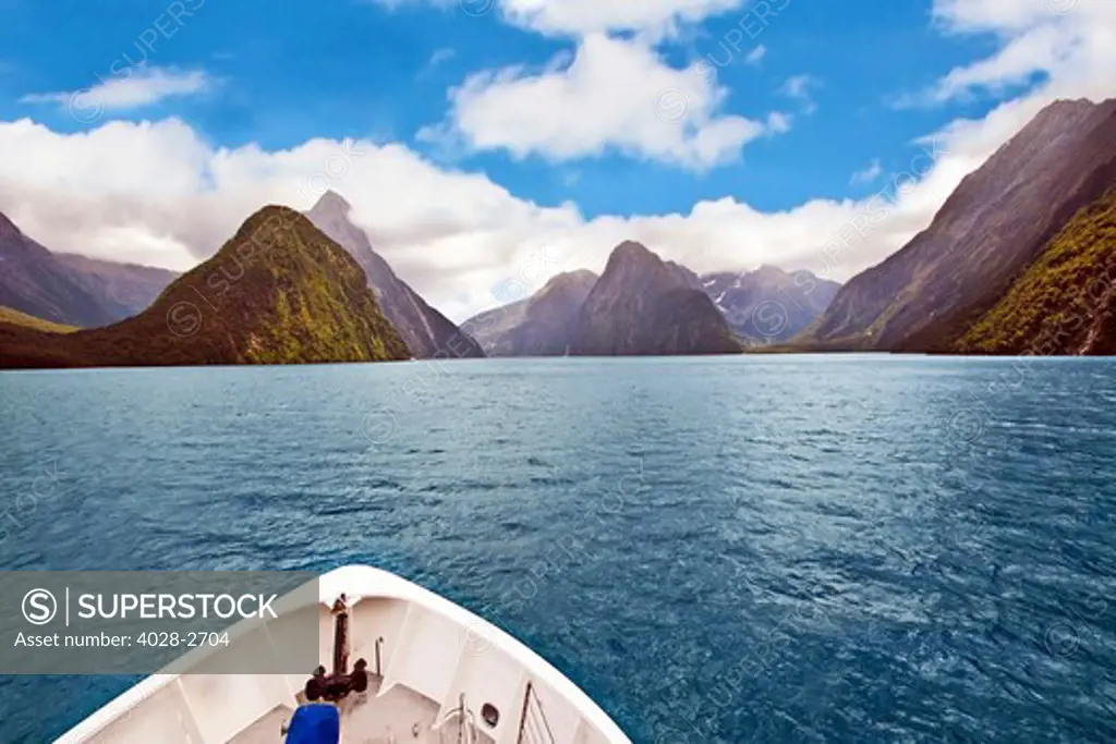 Milford Sound, Fiordland National Park, New Zealand, View of Milford Sound from the bow of a ship with Mitre peak in the background.