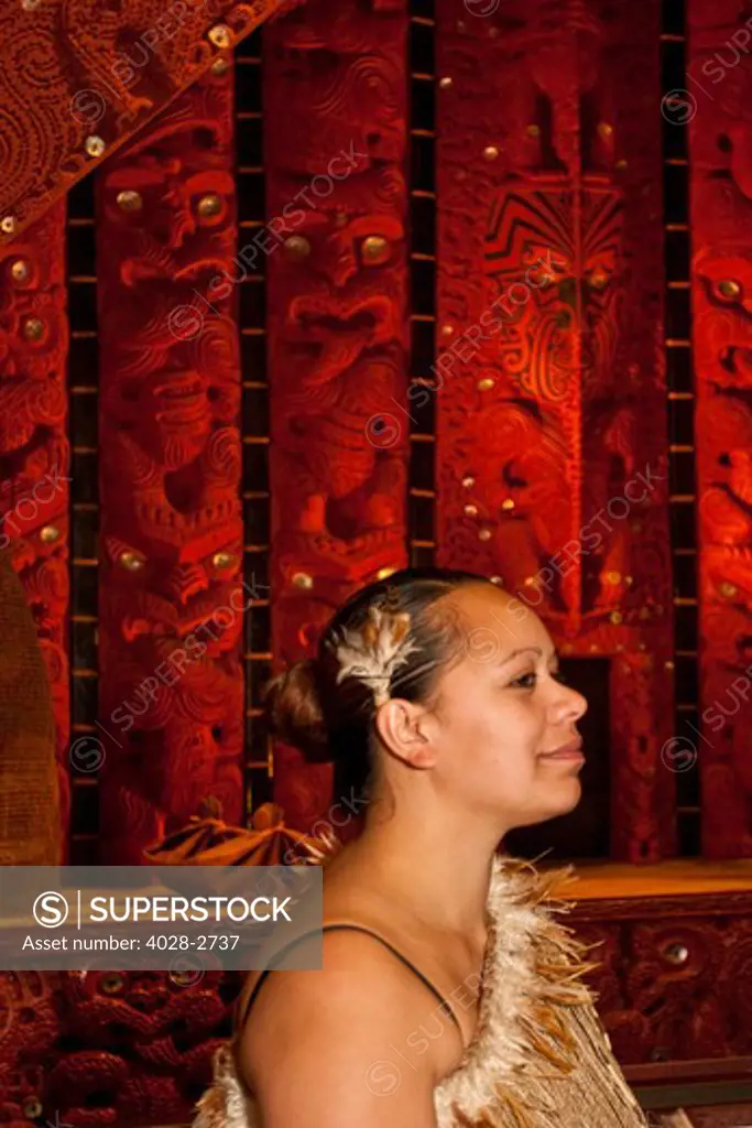 Auckland, Rotorua, New Zealand, Portrait of Maori woman dressed in traditional clothing.