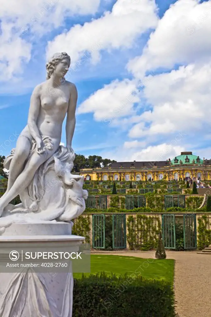 Germany, Brandenburg, Preussen, Potsdam, A statue of the Greek goddess Venus next to the terraced gardens in front of main facade of Sans Souci Palace.