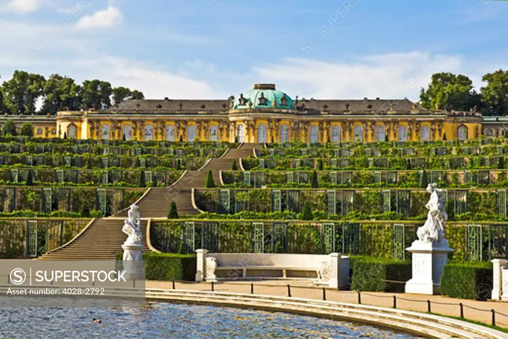 Germany, Brandenburg, Preussen, Potsdam, statues of the Greek god Mercury and the goddess Artemis next to the terraced gardens in front of main facade of Sans Souci Palace.