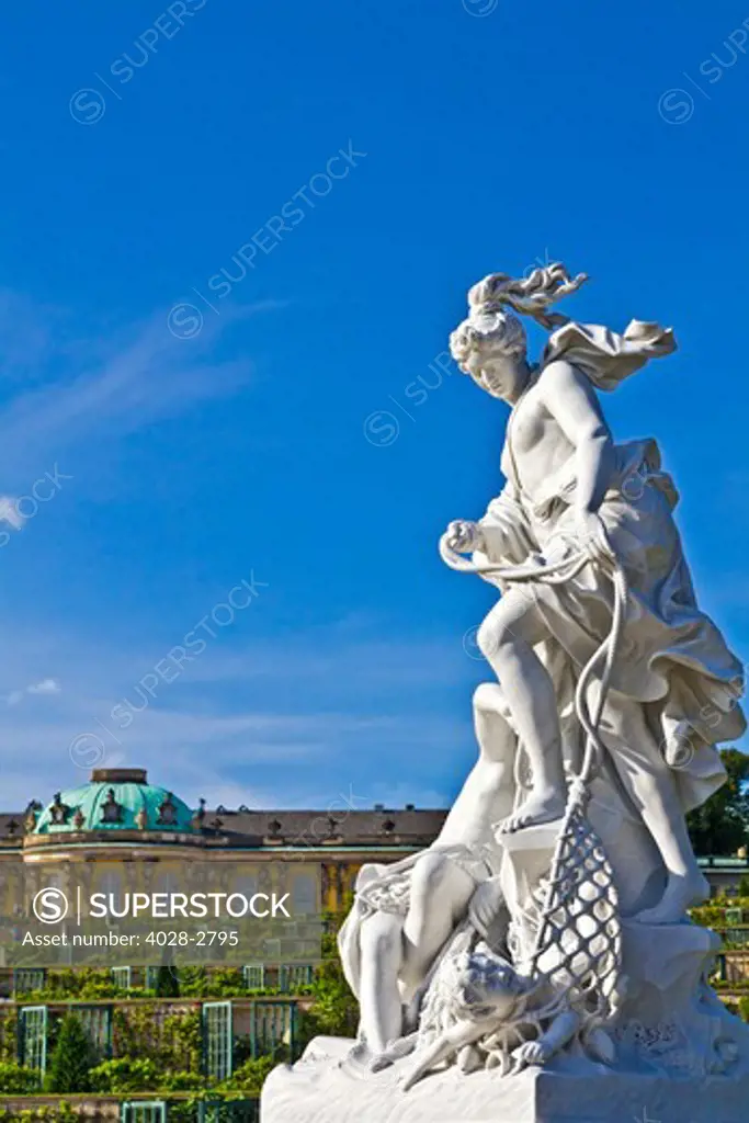 Germany, Brandenburg, Preussen, Potsdam, A statue of the Greek goddess Artemis next to the terraced gardens in front of main facade of Sans Souci Palace.