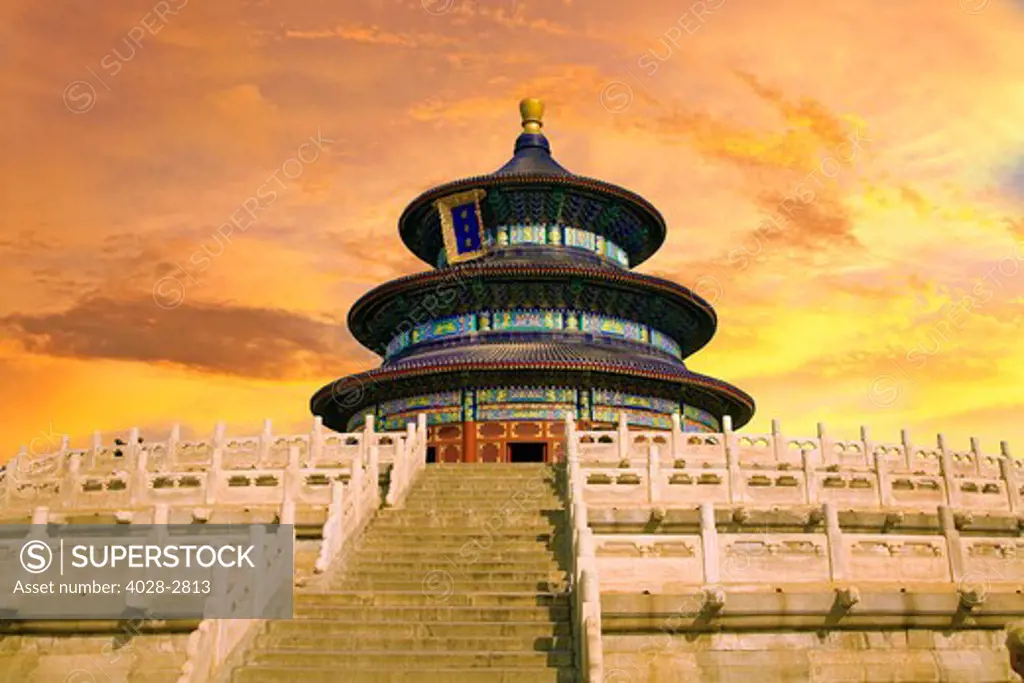 China, Beijing, Temple of Heaven, as tourists climb from bottom of stairs.