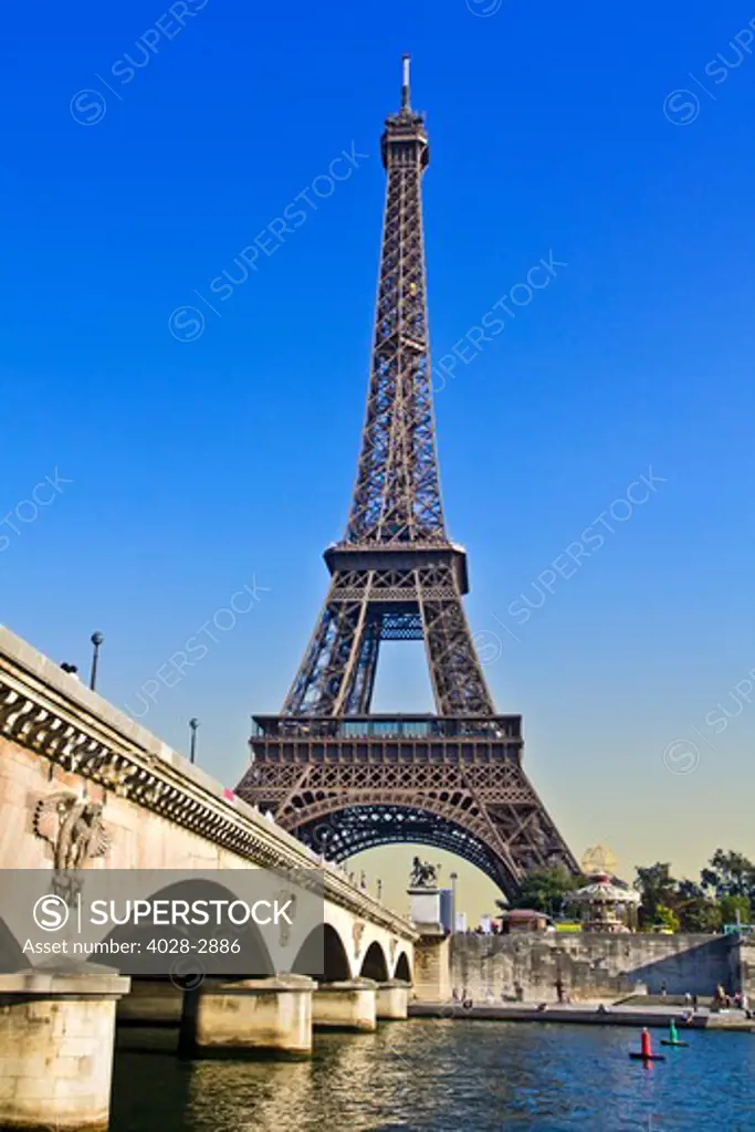 Paris, ile-de-France, France, the Eiffel Tower (Tour Eiffel) with the Pont D'Lena bridge over the Seine River