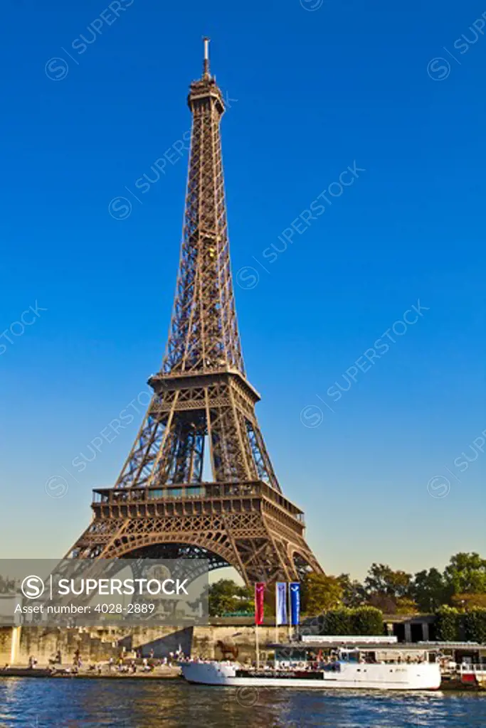 Paris, ile-de-France, France, the Eiffel Tower (Tour Eiffel) towers above the Seine River