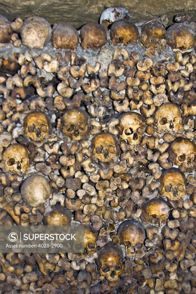 Paris, France, Ile-de-France, bones and skulls in the Catacombs arranged in the shape of a heart in the mass underground graveyard of Paris in Montparnasse