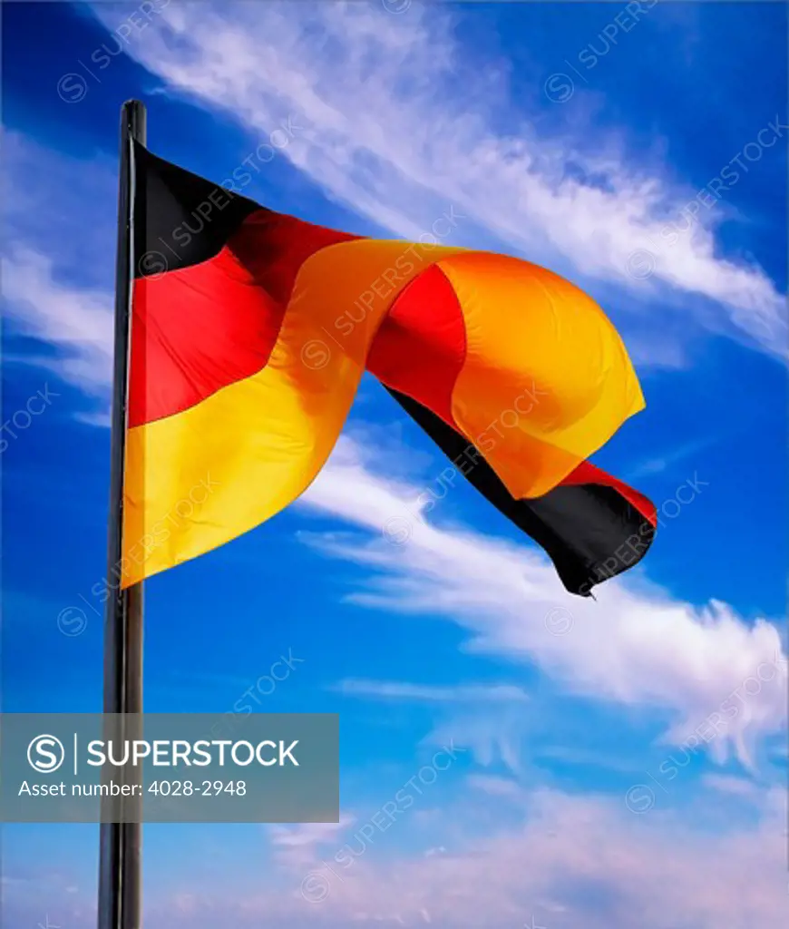Berlin, Germany, Flag of the Federal Republic Of Germany on a flagpole waving in the breeze.
