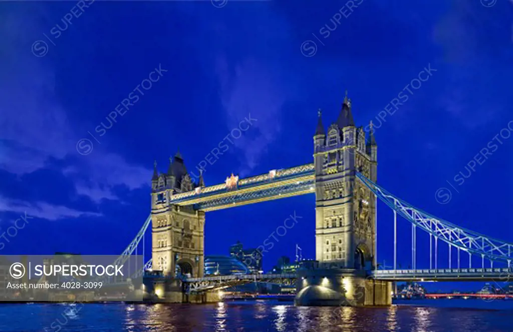 London, England, United Kingdom,  Reflections of the Floodlit Tower Bridge over the River Thames in the evening