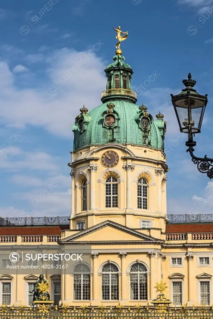 Germany, Berlin, Berlin Charlottenburg, Charlottenburg Palace, the facade and dome along with an ornate street lampost