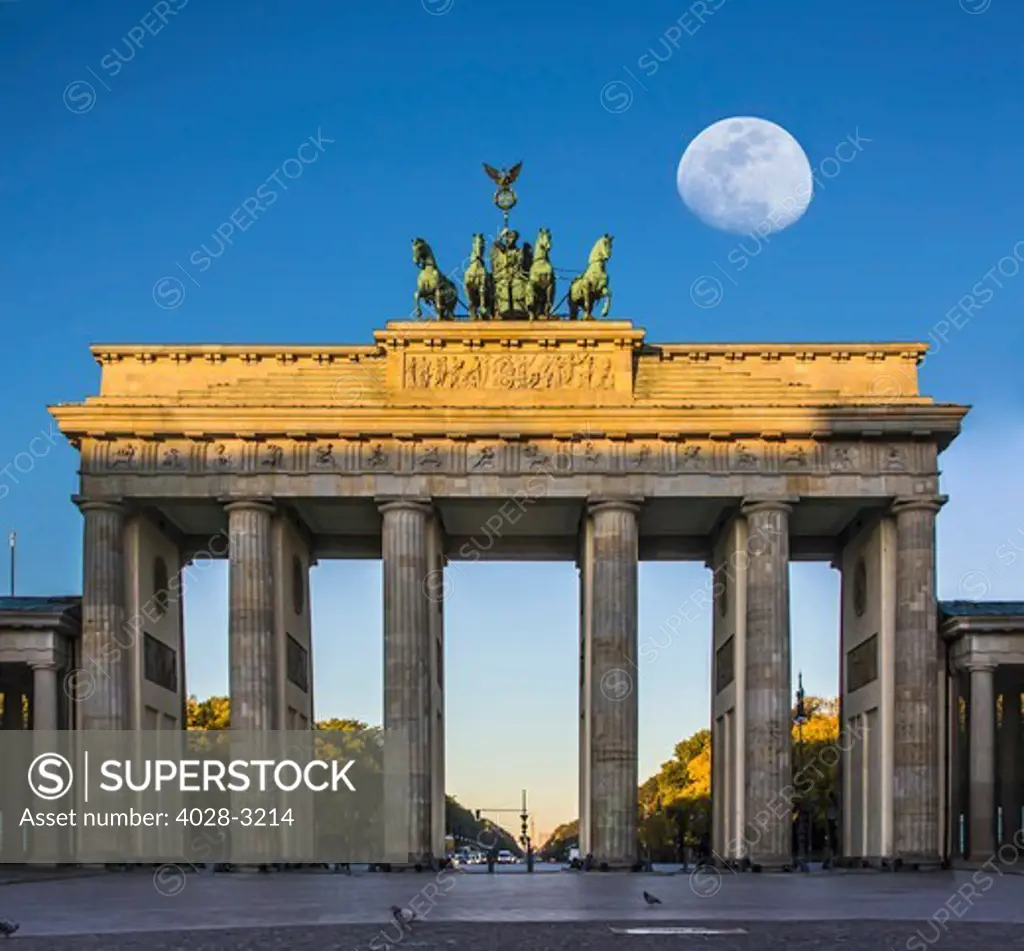 Berlin, Germany, the Brandenburg Gate (Brandenburger Tor) with the full moon (Super Moon).