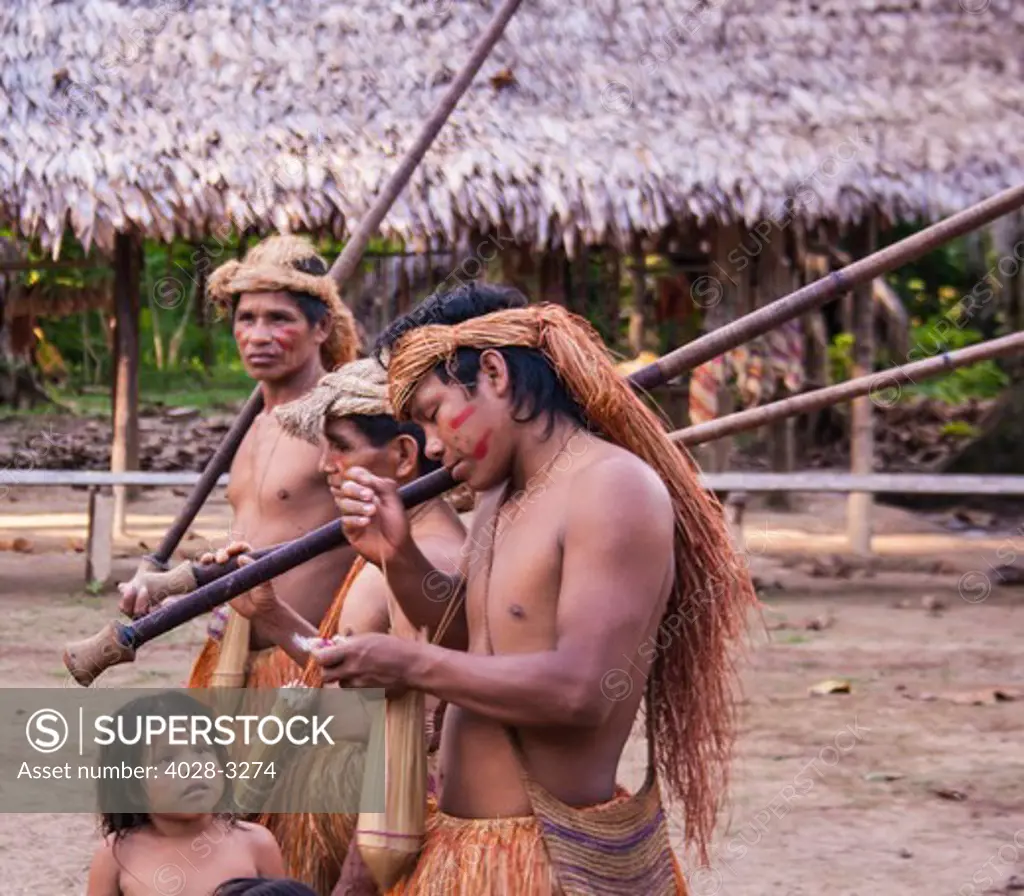 Iquitos, Peru, Amazon Jungle, Yagua Tribesmen show their cermonial traditions in their village square.