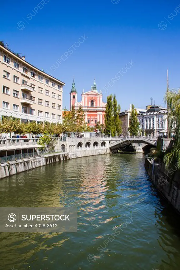 The Ljubljanica river, Ljubljana city, Slovenia in front of the the Triple Bridge leading to Presernov Square and the Church of the Annunciation