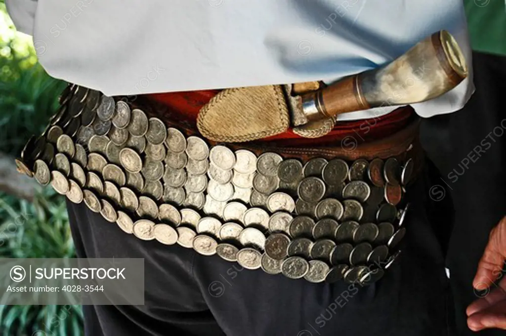 South America, Argentina, Gaucho at La Pampa Estancia, detail of silver belt and knife