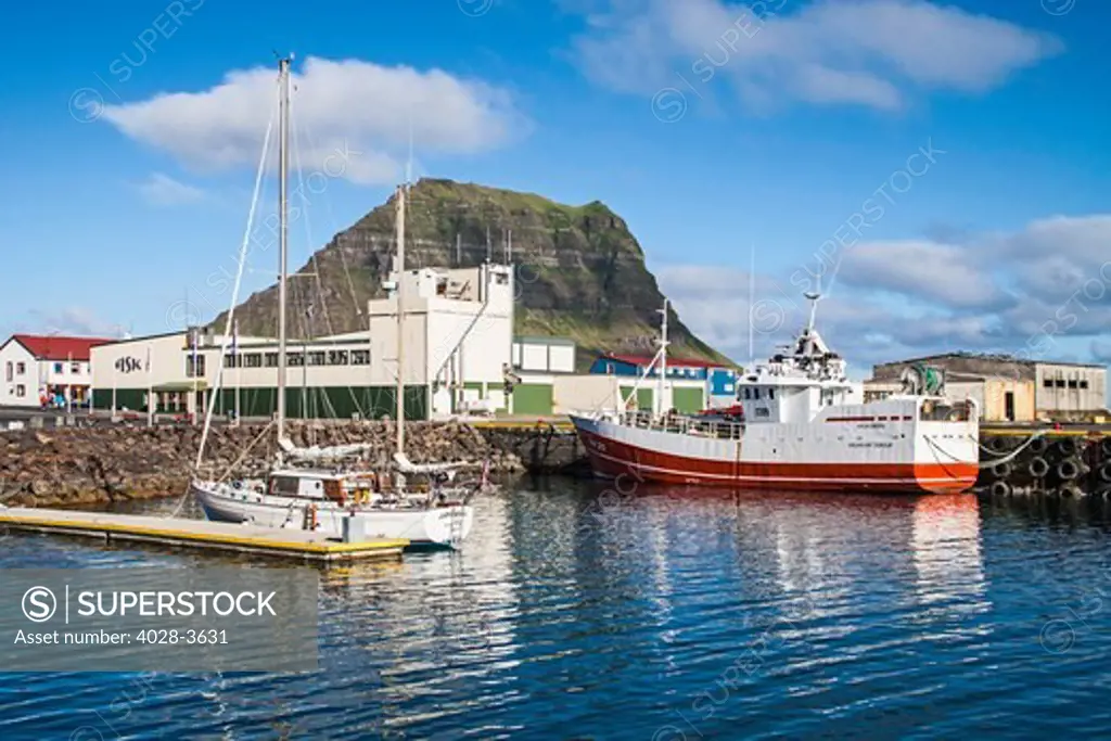 Iceland, Snaefellsnes Peninsula, boats docked at Grundarfjordur Harbor with Mt Kirkjufell in the background