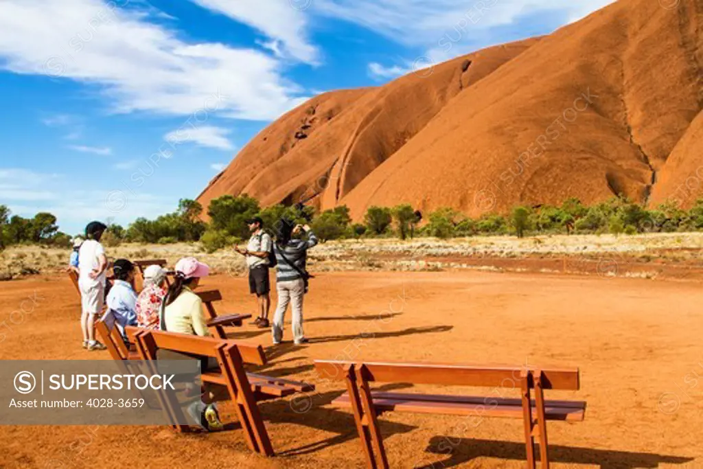 Australia, Northern Territory, NT, Asian tourists get a guide of the holy mountain of Uluru, Ayers Rock, Uluru-Kata Tjuta National Park