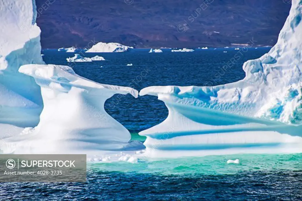 Greenland, Discovery Bay, (Disko Bay) A heart shapped space is created by floating icebergs from the Ilulissat Kangerlua Glacier also known as Sermeq Kujalleq