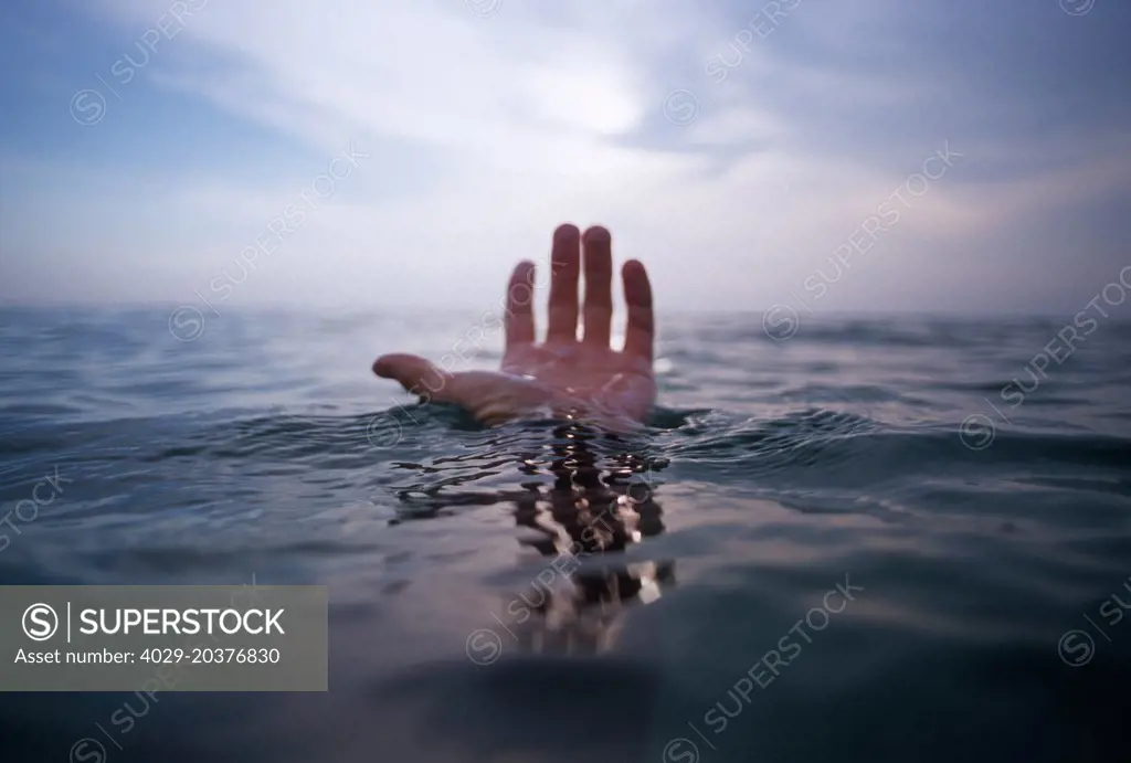 Hand coming out of the ocean