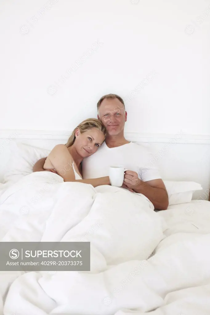Happy couple in the bed 