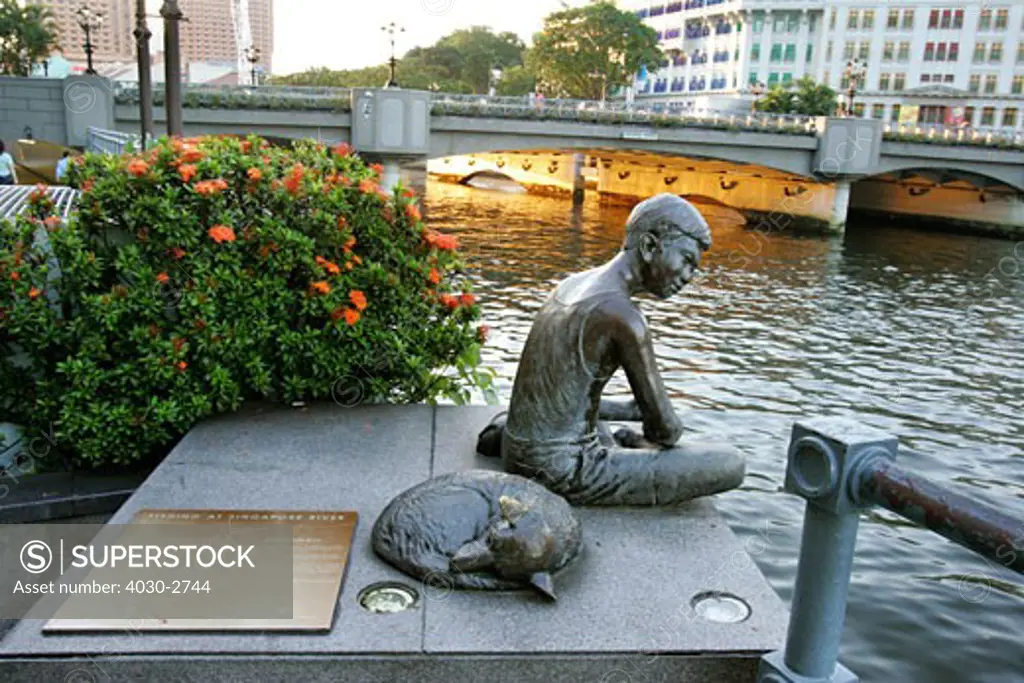 Statue of Boy Fishing on the side of Singapore River, Singapore, South East Asia