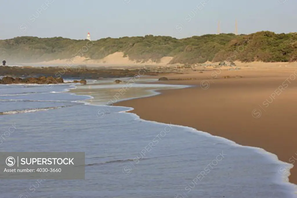 M'Bashee Lighthouse, located in a remote area on the east side of the mouth of the M'Bashee Rive , Wild Coast, Eastern Cape, South Africa 