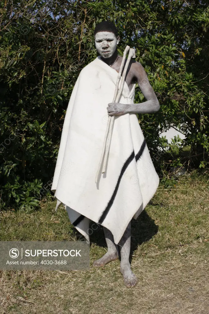 African adolscent Initiate (abakwetha). After ritual circumcision the initiates live in isolation for up to several weeks painted in white clay.