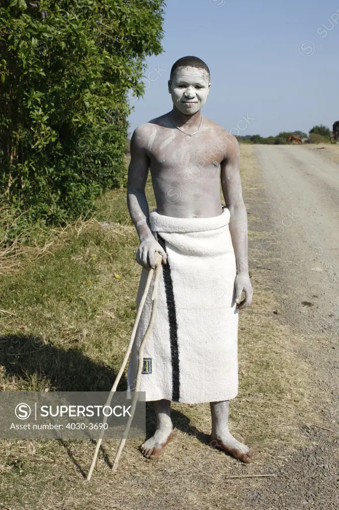 African adolscent Initiate (abakwetha). After ritual circumcision the initiates live in isolation for up to several weeks painted in white clay.