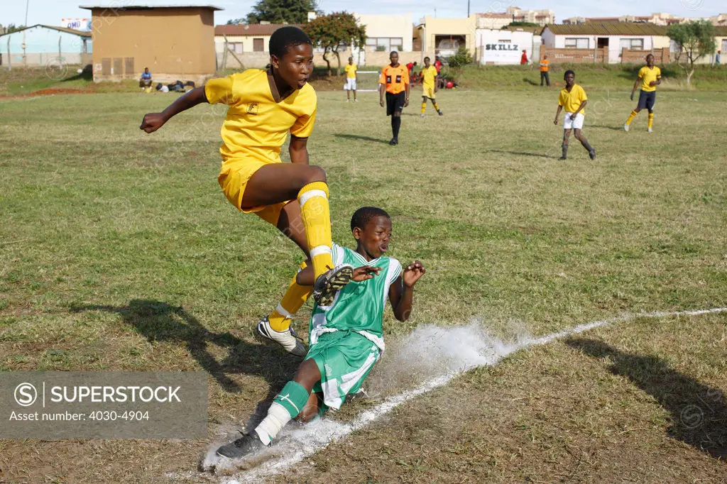 Boys playing soccer in Township, Port Elizabeth, South Africa