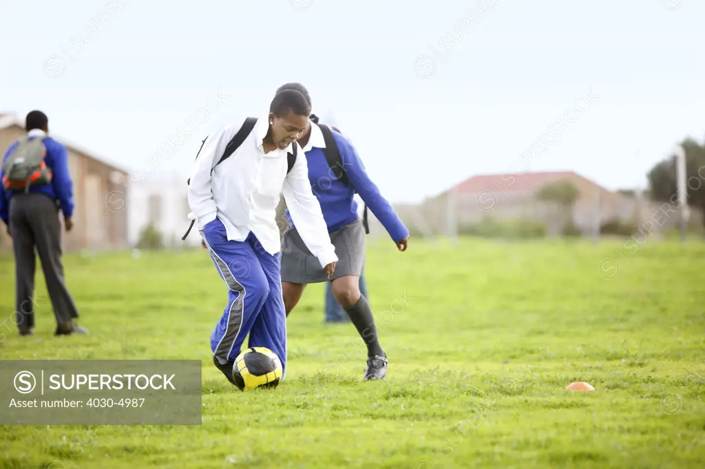 Schoolgirls playing with soccer ball, Cape Town, South Africa
