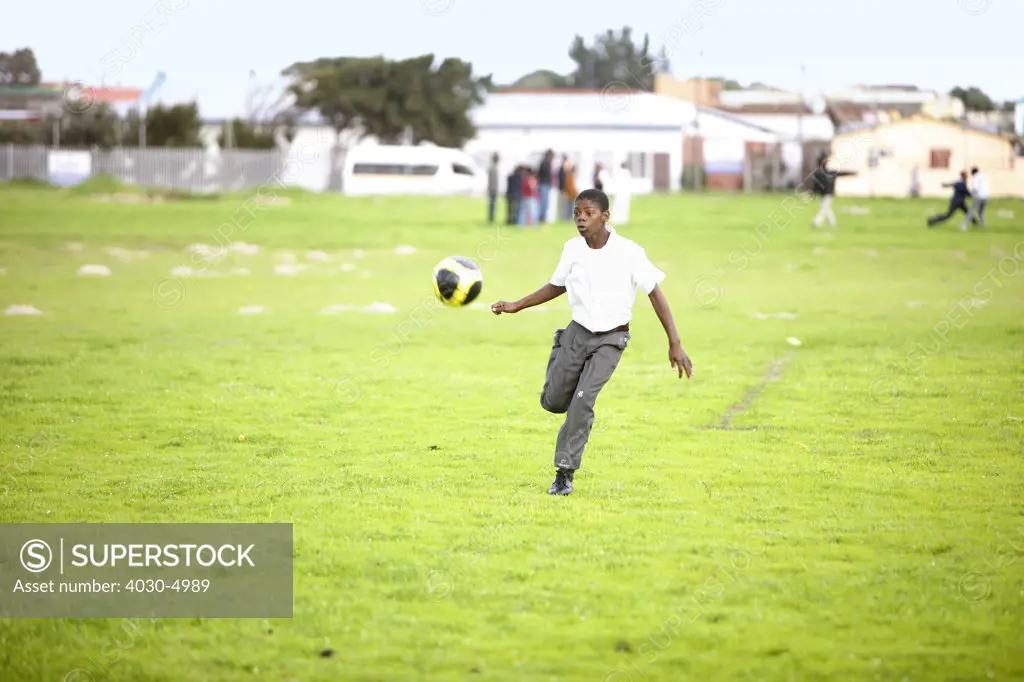 School boy kicking Soccer Ball, Cape Town, South Africa