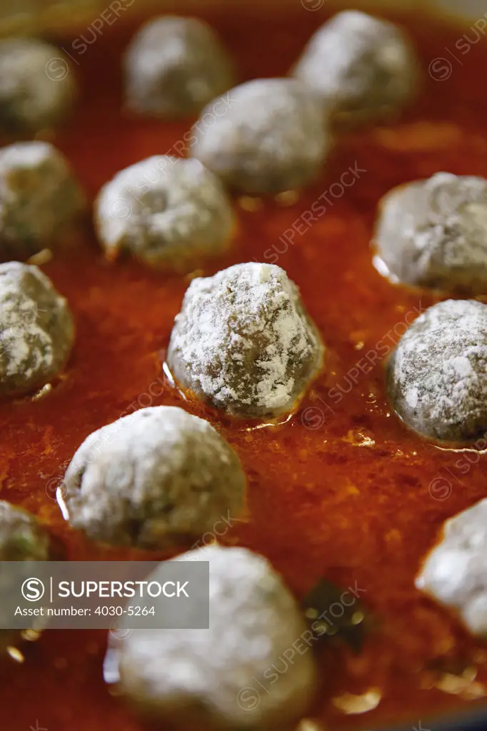 Meatballs poached in Tomato Sauce