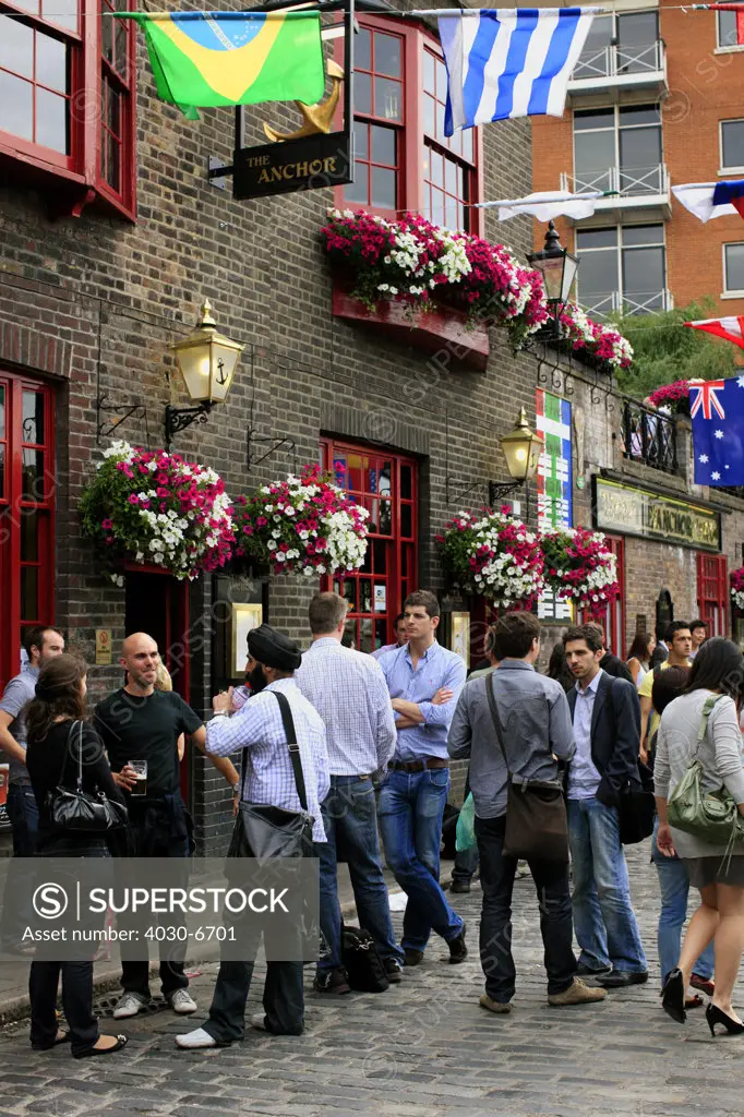 People Outside a London Pub
