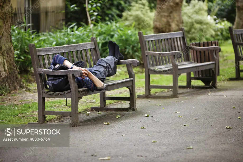 Man Sleeping on a Park Bench, London