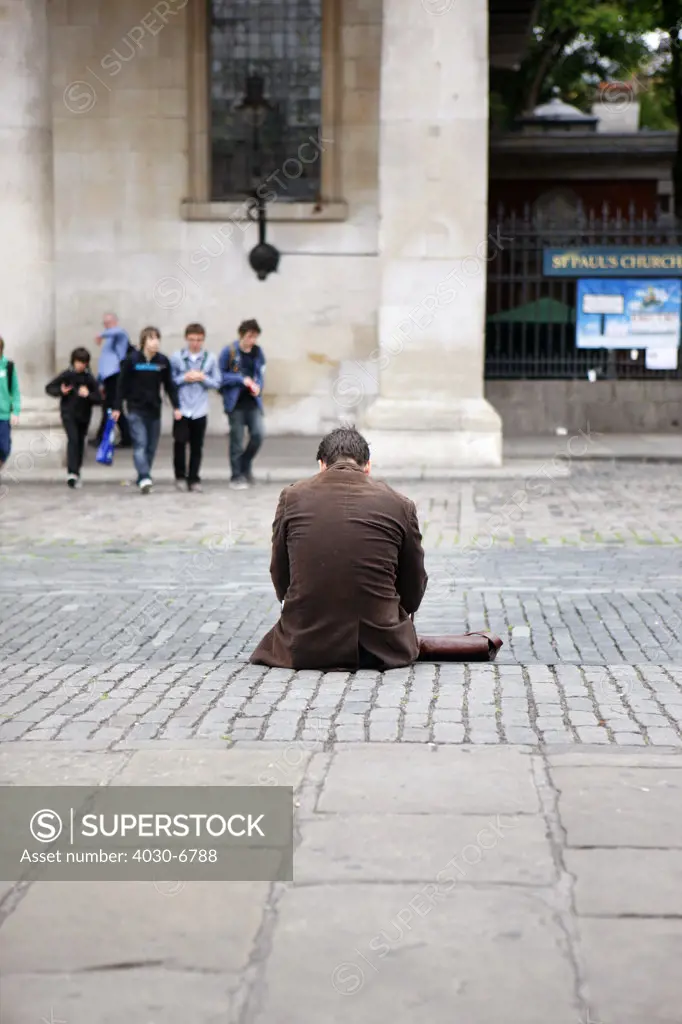 Man Sitting on Covent Garden Sidewalk, London