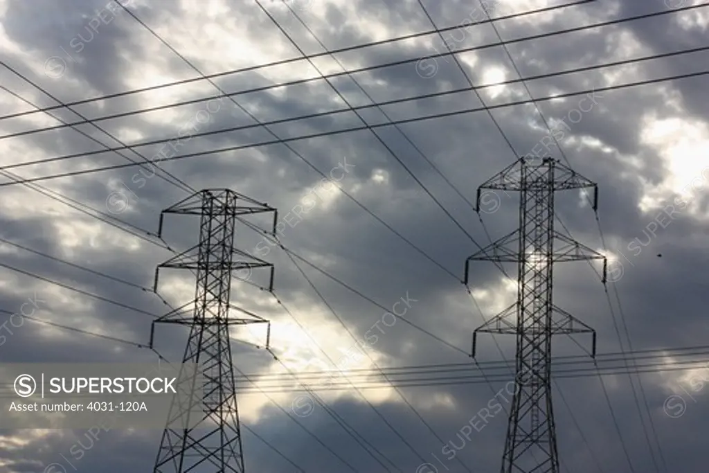 Electrical towers with criss-crossing power lines. Modesto, California, USA