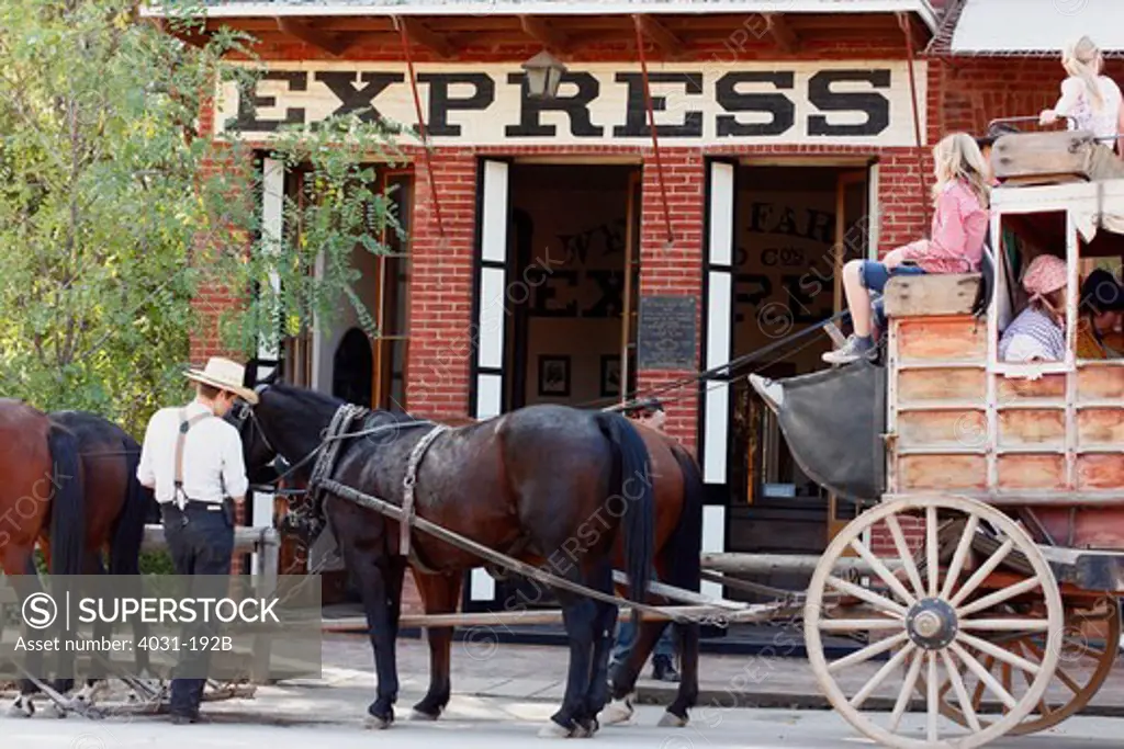 Tourists on stagecoach in front of a bank, Wells Fargo and Company, Columbia State Historic Park, Columbia, Tuolumne County, California, USA