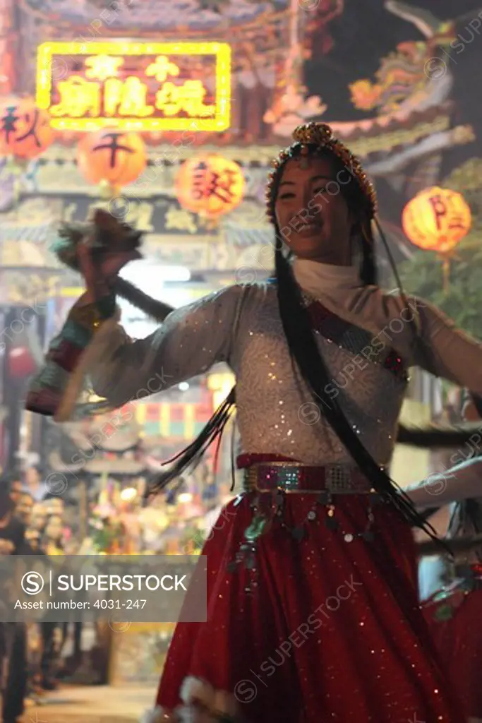 Temple dancer performing during celebration, Tainan, Taiwan
