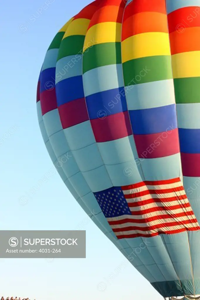 USA, California, Ripon, Hot air balloon with American flag at Color the Skies Hot Air Balloon Festival