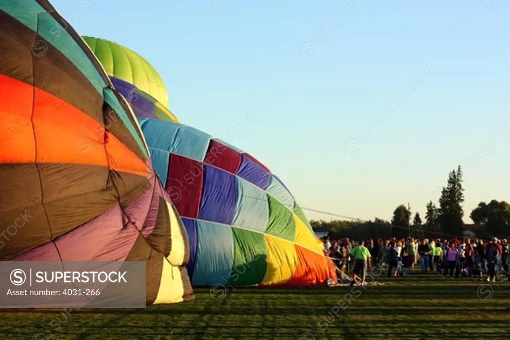 USA, California, Ripon, Spectators watching hot air balloon inflation at Color the Skies Hot Air Balloon Festival