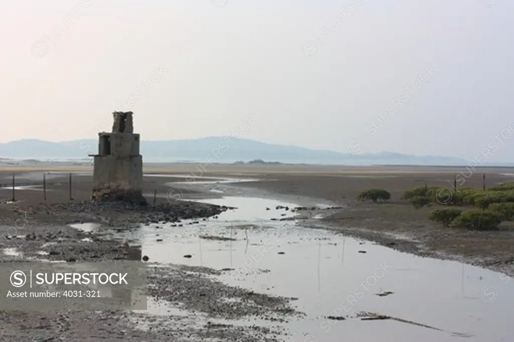 Taiwan, Kinmen County, Jincheng, Old military bunker offshore at low tide