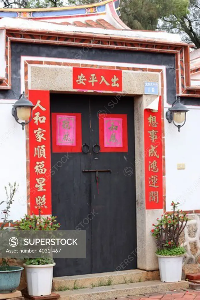 Taiwan, Kinmen County, Kinmen National Park, Shuitou Village, Door to old house with swallow tail style architecture