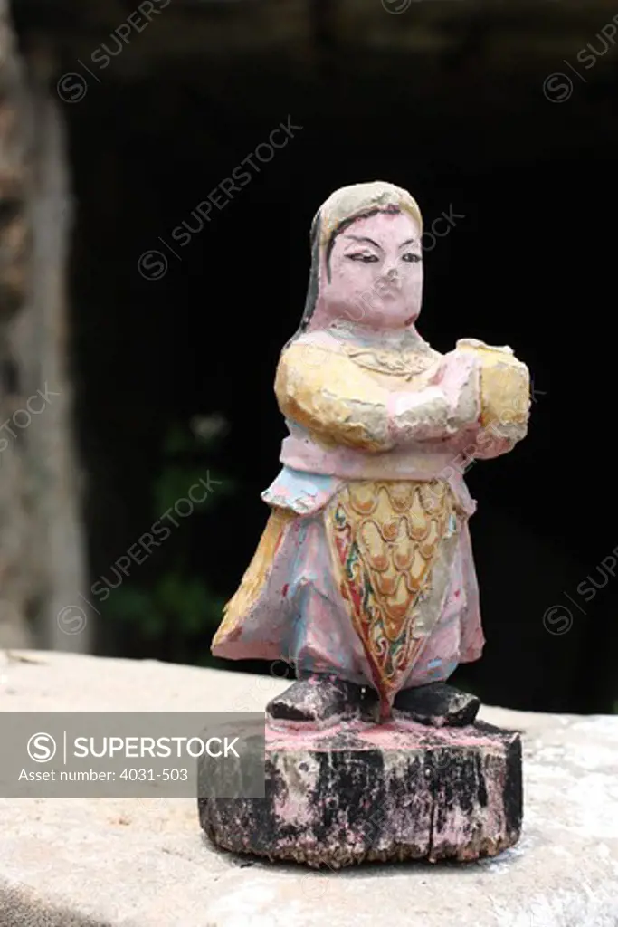 Taiwan, Kinmen County, Statue of Taoist god at old abandoned military camp at beach