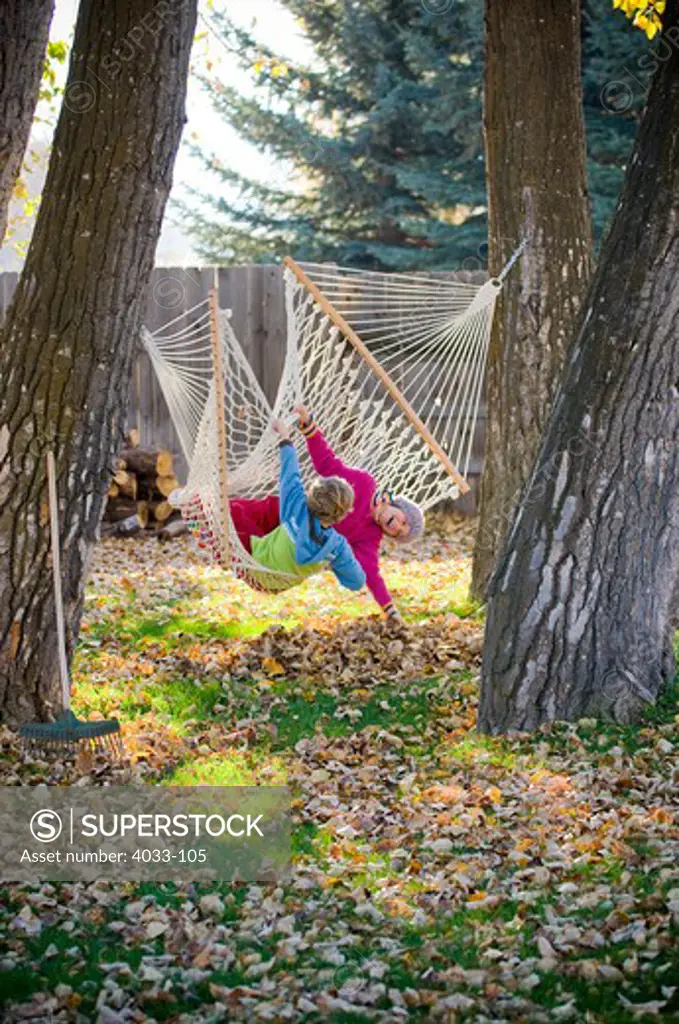 Kids playing in a hammock, Bozeman, Gallatin County, Montana, USA