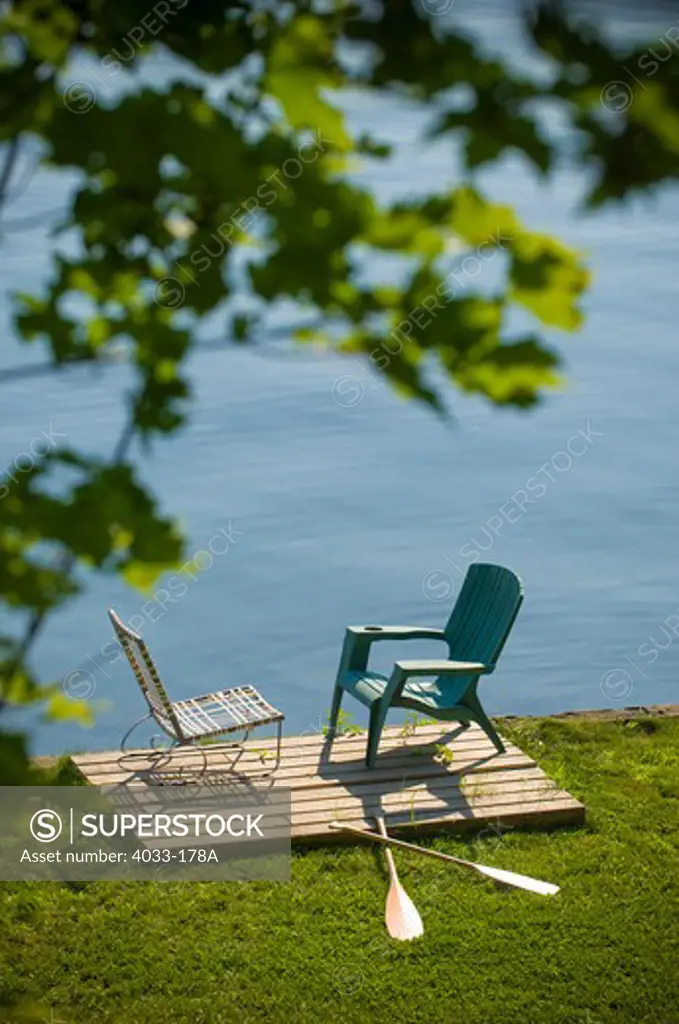 Two chairs and oars at the lakeside, Ithaca, New York State, USA