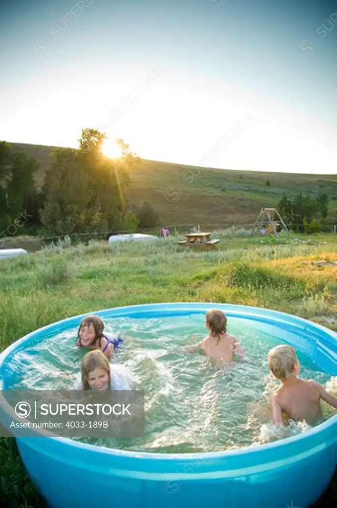Children playing in a wading pool, Bozeman, Gallatin County, Montana, USA