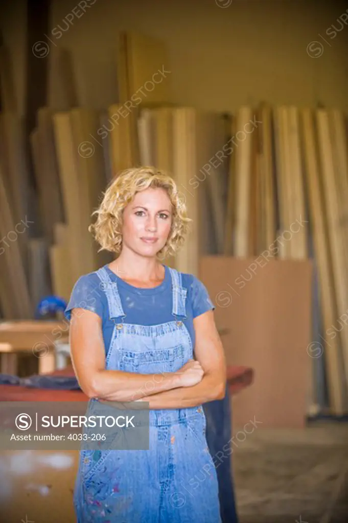 Young woman standing in her workshop, San Diego, California, USA