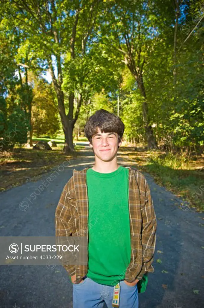 Young man standing on a road, Jamestown, Rhode Island, USA