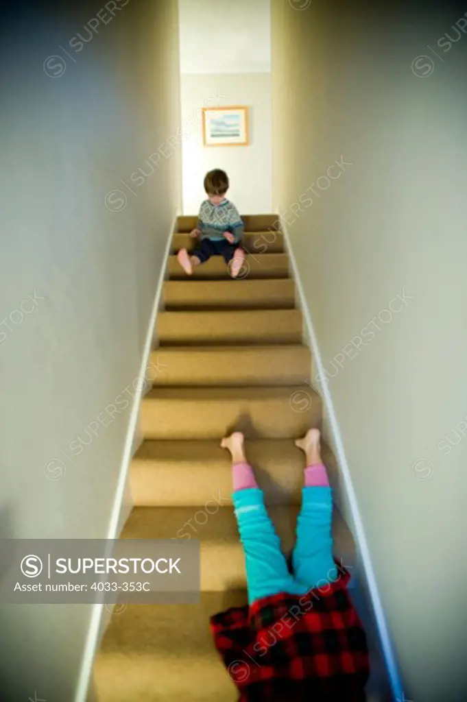 Girl falling down from stairs, Ithaca, New York State, USA