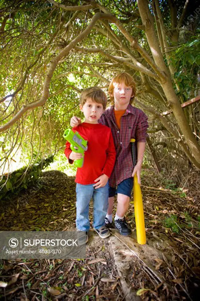 Two boys in forest, San Diego, California, USA